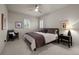 A well-lit bedroom features a ceiling fan and modern design at 10524 Serengeti Dr, Lone Tree, CO 80124