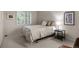Comfortable bedroom features a neutral palette, plush carpeting, and a large window at 10524 Serengeti Dr, Lone Tree, CO 80124
