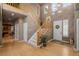 Foyer has hardwood floors and a view of the staircase to the second story at 10524 Serengeti Dr, Lone Tree, CO 80124