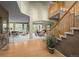 The foyer features hardwood floors and an open staircase at 10524 Serengeti Dr, Lone Tree, CO 80124
