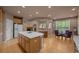 Open kitchen with a center island flows seamlessly into an adjacent eat-in area at 10524 Serengeti Dr, Lone Tree, CO 80124