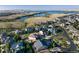 Aerial view of the neighborhood with beautiful landscaping and nearby lake, showcasing the homes and community layout at 27235 E Lakeview Pl, Aurora, CO 80016