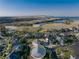Aerial view of home showcasing surrounding neighborhood amenities like a lake and community pool at 27235 E Lakeview Pl, Aurora, CO 80016
