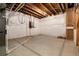 Spacious unfinished basement with concrete floor and white wall coverings at 27235 E Lakeview Pl, Aurora, CO 80016