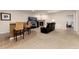 Finished basement with a wet bar, fireplace, media center, and exercise space at 27235 E Lakeview Pl, Aurora, CO 80016