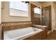 Bathroom featuring soaking tub and glass shower at 27235 E Lakeview Pl, Aurora, CO 80016