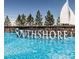 Southshore community sign with water feature and a sailboat sculpture under a clear blue sky at 27235 E Lakeview Pl, Aurora, CO 80016