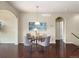 Bright dining area featuring hardwood floors, chandelier, and seating for four at 27235 E Lakeview Pl, Aurora, CO 80016