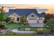 Charming home with a three-car garage, a well-manicured lawn, and lovely landscaping at 27235 E Lakeview Pl, Aurora, CO 80016