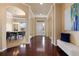 Elegant foyer featuring hardwood floors, arched doorways, and a view into the dining room at 27235 E Lakeview Pl, Aurora, CO 80016