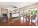 Elegant living space features hardwood floors, a cozy fireplace, and abundant natural light, perfect for relaxation and gatherings at 27235 E Lakeview Pl, Aurora, CO 80016