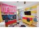 Fun bedroom featuring custom bunk bed, hardwood floors, and ample storage at 1817 S Perry Way, Denver, CO 80219