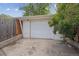 The property features a detached garage and adjacent driveway at 1817 S Perry Way, Denver, CO 80219
