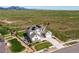 Aerial view of home with solar panels, manicured lawn, and mountain views at 9571 Yucca Ct, Arvada, CO 80007