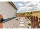 Private backyard with gravel, stone walkway, and wood fence; great for outdoor relaxation at 9571 Yucca Ct, Arvada, CO 80007