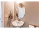 This bathroom has a toilet, sink, faucet, and towel rack at 9571 Yucca Ct, Arvada, CO 80007