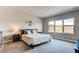 Inviting bedroom featuring a comfortable bed, serene views, and soft, neutral tones for a relaxing ambiance at 9571 Yucca Ct, Arvada, CO 80007