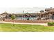 Community pool with seating, landscaping, and clubhouse at 9571 Yucca Ct, Arvada, CO 80007