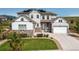 Charming two-story home with stone accents, landscaped lawn, and a welcoming front porch and 2 car garage at 9571 Yucca Ct, Arvada, CO 80007