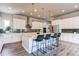 Contemporary kitchen with stainless steel appliances, sleek white cabinetry, and a spacious center island at 9571 Yucca Ct, Arvada, CO 80007