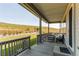 Cozy covered porch with comfortable seating and views of the yard at 9571 Yucca Ct, Arvada, CO 80007