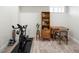 Finished basement with exercise equipment, desk, and carpeted floors at 2012 W 46Th Ave, Denver, CO 80211