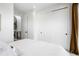 Bright bedroom features a bed with white bedding and a large closet with sliding doors at 2012 W 46Th Ave, Denver, CO 80211
