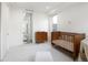 Bright Bedroom with crib, dresser, and neutral decor at 2012 W 46Th Ave, Denver, CO 80211