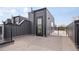 Modern exterior with black siding and a rooftop patio with black metal railing at 2012 W 46Th Ave, Denver, CO 80211