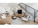 Comfortable living room with modern staircase and beautiful furniture at 2012 W 46Th Ave, Denver, CO 80211