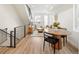 Inviting living room featuring modern decor, hardwood floors, and staircase with black metal railing at 2012 W 46Th Ave, Denver, CO 80211