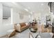 Bright living room showcasing open layout, modern decor, and seamless flow to the kitchen at 2012 W 46Th Ave, Denver, CO 80211