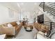 Inviting living room showcasing an open concept, stylish furnishings, and seamless kitchen access at 2012 W 46Th Ave, Denver, CO 80211
