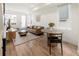 Bright and airy living room with hardwood floors, modern decor, and a welcoming atmosphere at 2012 W 46Th Ave, Denver, CO 80211