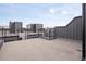 Spacious rooftop deck with modern railings, perfect for entertaining and enjoying city views at 2012 W 46Th Ave, Denver, CO 80211