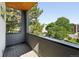 This balcony features wood flooring and a gorgeous view of the surrounding trees and city at 2830 W 32Nd Ave, Denver, CO 80211