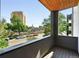 This balcony features wood flooring and a beautiful view of the city and surrounding greenery at 2830 W 32Nd Ave, Denver, CO 80211