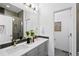 Modern bathroom with a double sink vanity, stylish tile accents, and a glass-enclosed shower at 2830 W 32Nd Ave, Denver, CO 80211