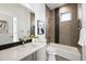 This bathroom features neutral colors, an integrated sink, shower, tub, and modern fixtures at 2830 W 32Nd Ave, Denver, CO 80211