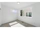 This carpeted bedroom features neutral paint, a window, and plenty of natural light at 2830 W 32Nd Ave, Denver, CO 80211