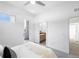 Minimalist bedroom with access to a balcony and a view into the ensuite bathroom, providing a spacious feel at 2830 W 32Nd Ave, Denver, CO 80211