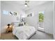 Bright bedroom featuring ample natural light, neutral decor, and a door leading to an outdoor space at 2830 W 32Nd Ave, Denver, CO 80211