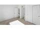 This carpeted bedroom features several doors and lots of neutral paint for a bright and spacious feel at 2830 W 32Nd Ave, Denver, CO 80211