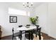 Stylish dining room with modern lighting and dark hardwood floors at 2830 W 32Nd Ave, Denver, CO 80211
