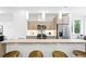 Contemporary kitchen with stainless steel appliances, under cabinet lighting, and breakfast bar with seating at 2830 W 32Nd Ave, Denver, CO 80211