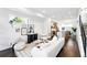 Stylish living room with open floor plan, modern decor, and seamless kitchen access at 2830 W 32Nd Ave, Denver, CO 80211