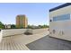 The rooftop deck features beautiful city views, wood flooring, and some safety features at 2830 W 32Nd Ave, Denver, CO 80211