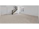 Unfinished basement with new carpet, a window, and view of the stairwell at 5625 W 141 Ln, Broomfield, CO 80020
