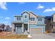 Charming two-story home with attached two car garage and covered front porch at 5625 W 141 Ln, Broomfield, CO 80020