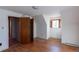 Upstairs bedroom features natural light, hardwood floors and a closet at 1996 S Linden Ct, Denver, CO 80224